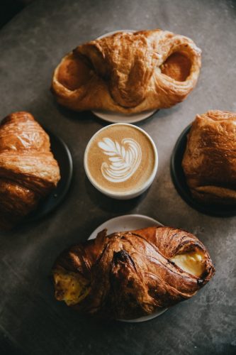 Croissants around a cup of coffee